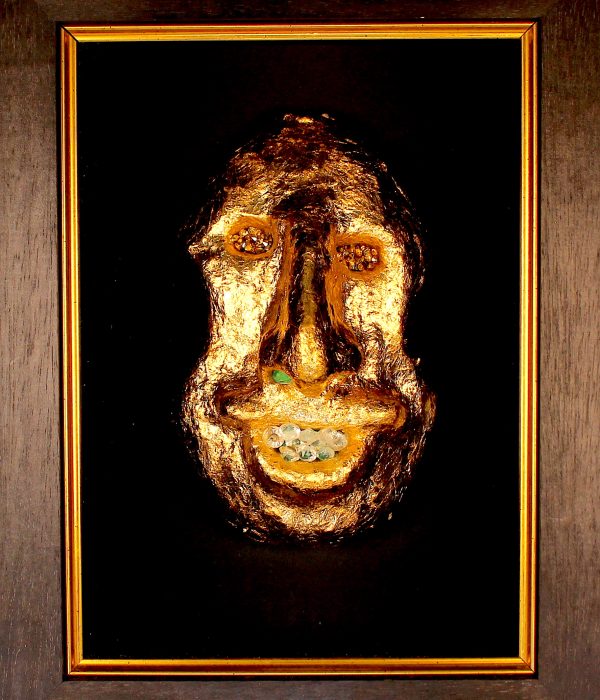 close crop gold mask on black with jewels